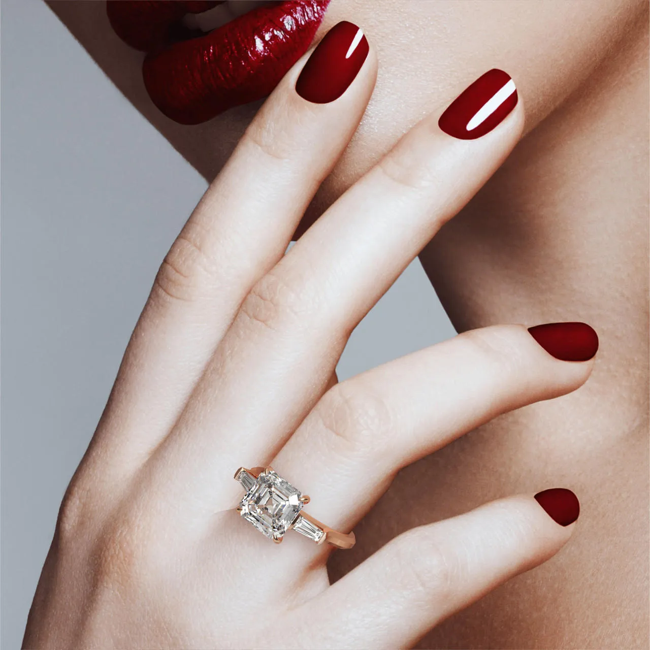 ASSCHER CUT DIAMOND ENGAGEMENT RING WITH A BAGUETTE FLANK THREE PHASES SLIM SETTING IN 18K ROSE GOLD