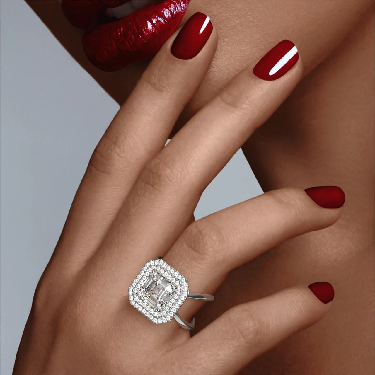 ASSCHER CUT DIAMOND ENGAGEMENT RING WITH A DOUBLE HALO AXIS SETTING IN PLATINUM