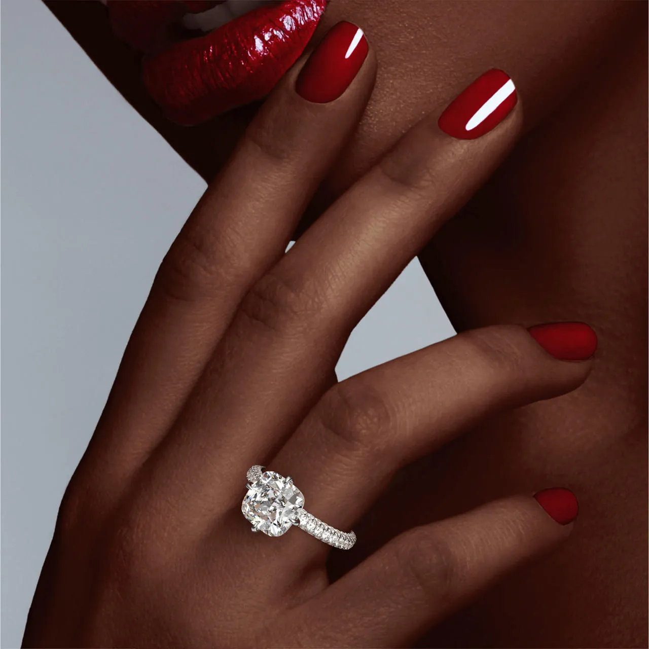 CUSHION CUT DIAMOND ENGAGEMENT RING WITH A COMPASS 4 PRONG THREE PHASES TRIPLE PAVE SETTING IN PLATINUM
