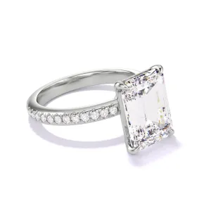 EMERALD CUT DIAMOND ENGAGEMENT RING WITH A CLASSIC 4 PRONG THREE PHASES PAVE SETTING IN PLATINUM
