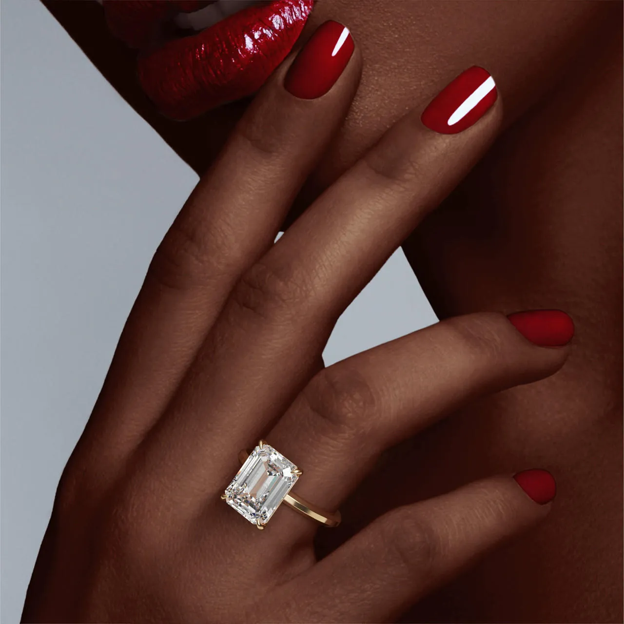 EMERALD CUT DIAMOND ENGAGEMENT RING WITH A CLASSIC 4 PRONG THREE PHASES SLIM SETTING IN 18K YELLOW GOLD