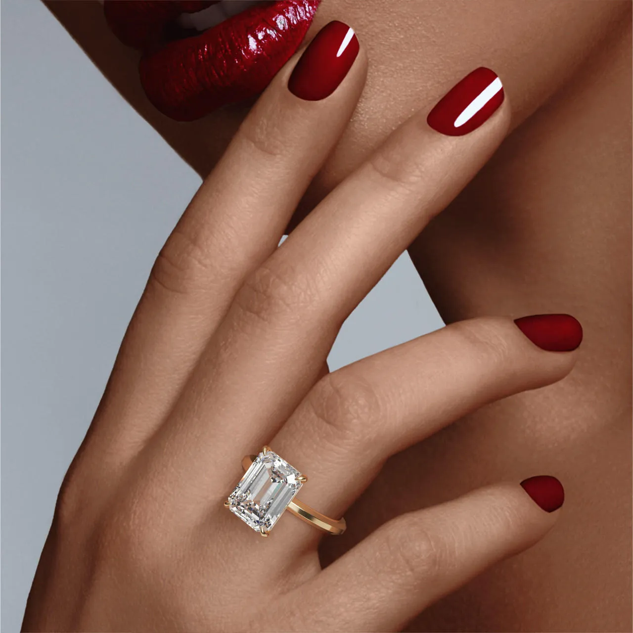 EMERALD CUT DIAMOND ENGAGEMENT RING WITH A CLASSIC 4 PRONG THREE PHASES SLIM SETTING IN 18K YELLOW GOLD