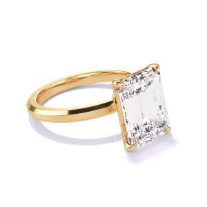 EMERALD CUT DIAMOND ENGAGEMENT RING WITH A CLASSIC 4 PRONG THREE PHASES SLIM SETTING IN 18K YELLOW GOLD