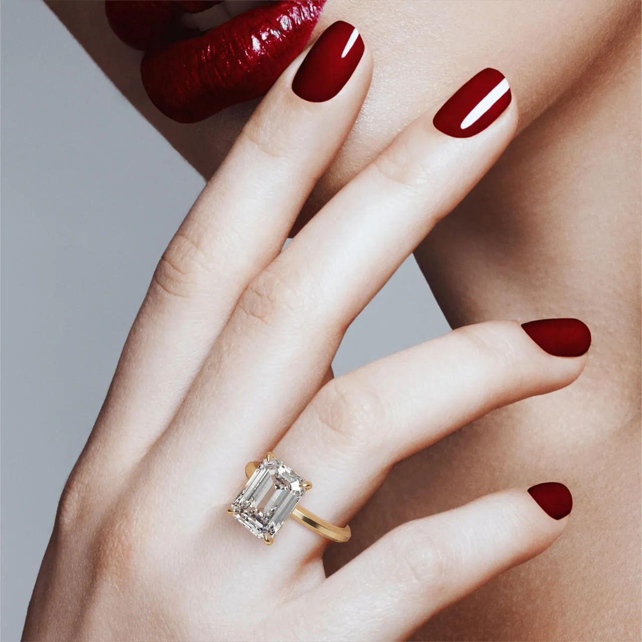 EMERALD CUT DIAMOND ENGAGEMENT RING WITH A CLASSIC 4 PRONG THREE PHASES SLIM SETTING IN 18K YELLOW GOLD
