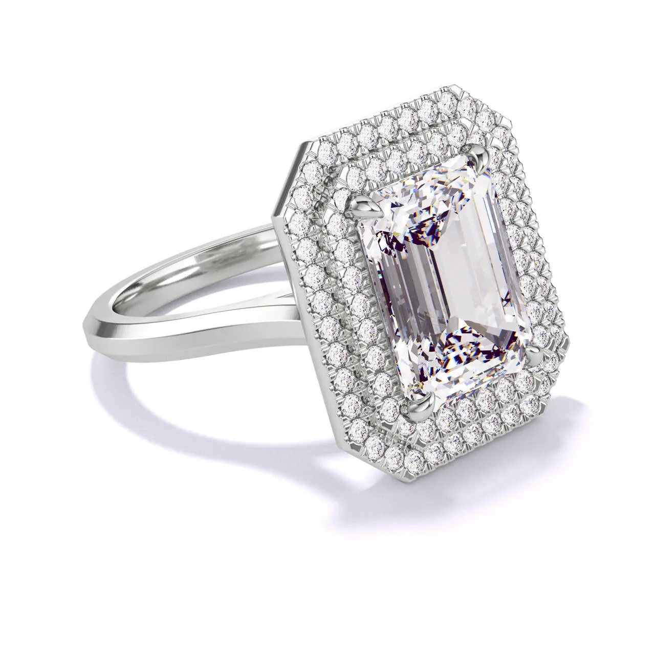 EMERALD CUT DIAMOND ENGAGEMENT RING WITH A DOUBLE HALO THREE PHASES SLIM SETTING IN PLATINUM
