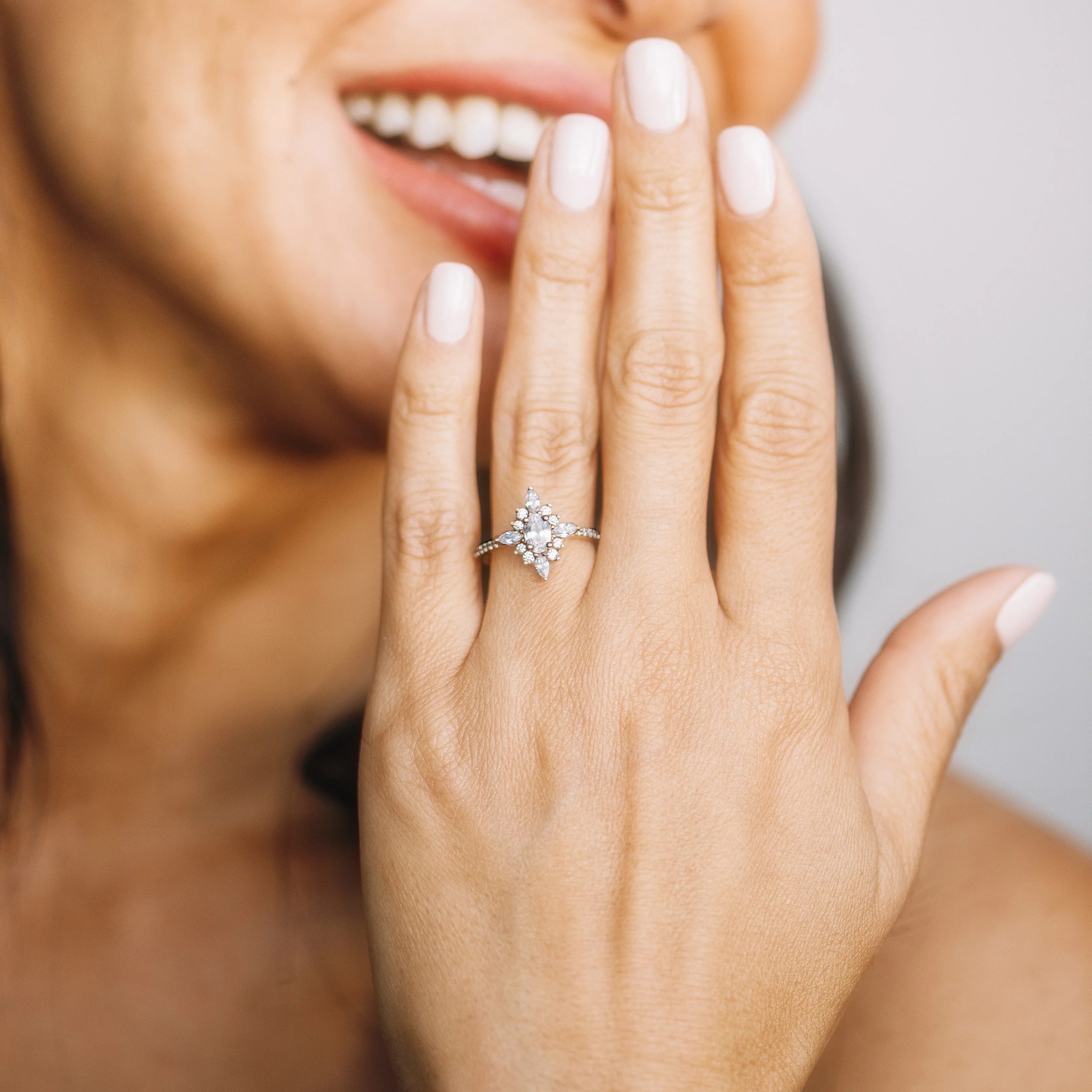 Oval Diamond and Starburst Flower Halo Engagement Ring Setting
