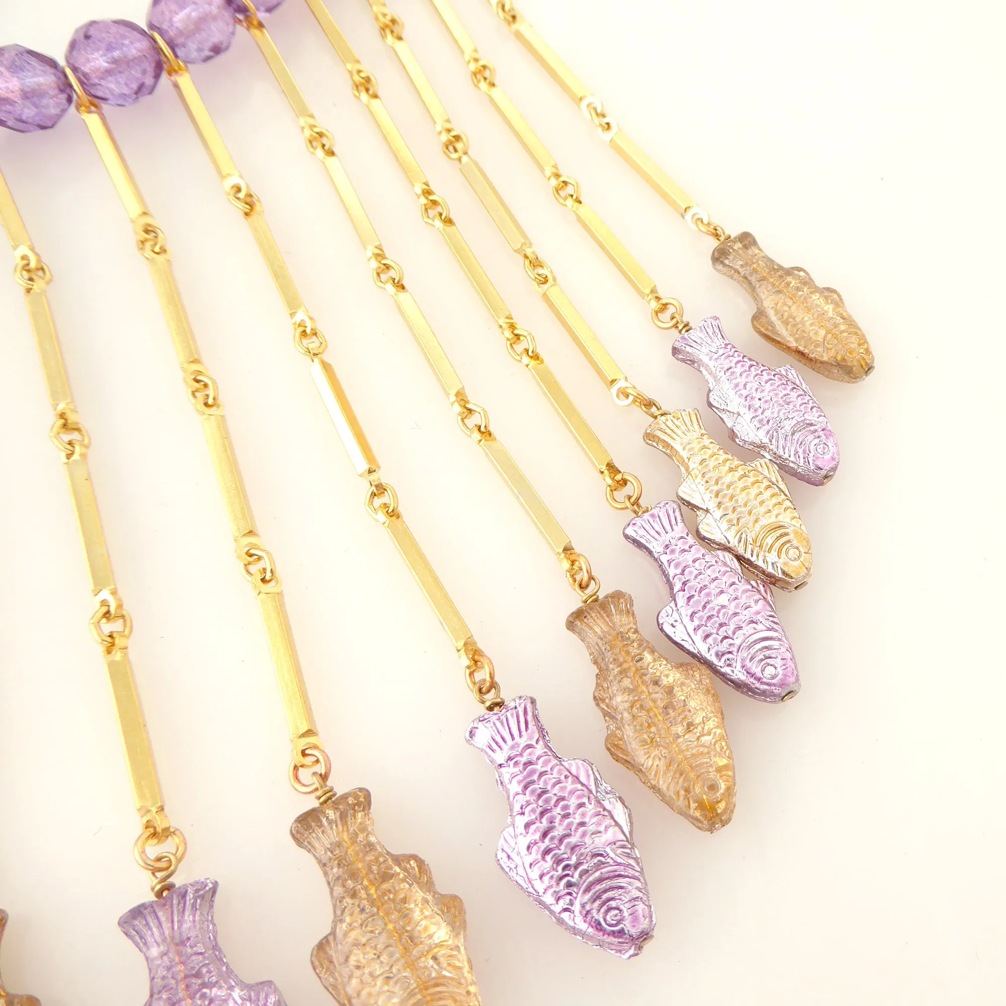 Purple metallic fish necklace