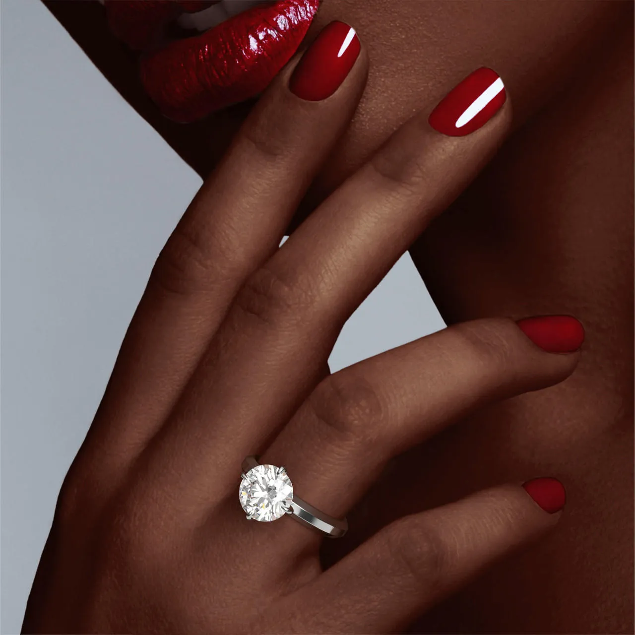 ROUND CUT DIAMOND ENGAGEMENT RING WITH A COMPASS 4 PRONG THREE PHASES SETTING IN PLATINUM