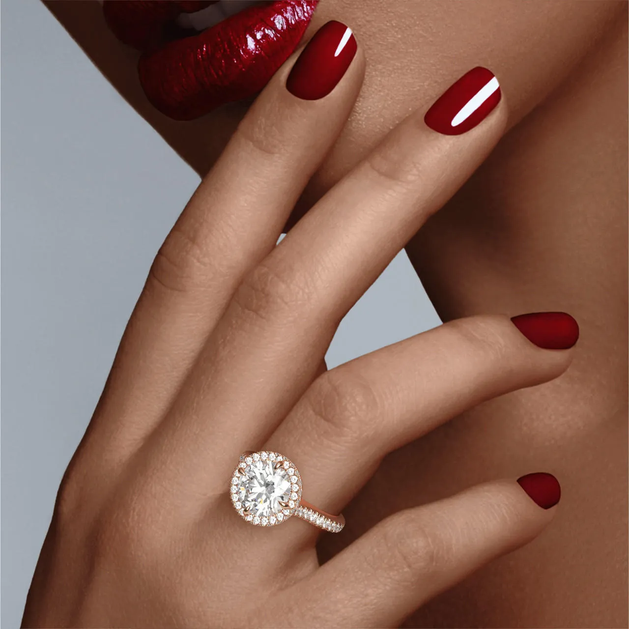 ROUND CUT DIAMOND ENGAGEMENT RING WITH A WRAPPED HALO THREE PHASES PAVE SETTING IN 18K ROSE GOLD