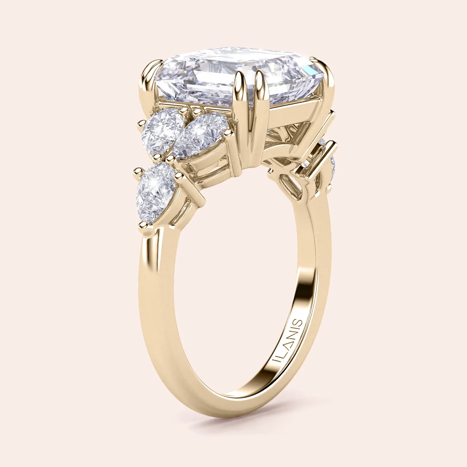 STARLET ASSCHER CUT DIAMOND RING WITH PEAR-SHAPED SIDE STONES