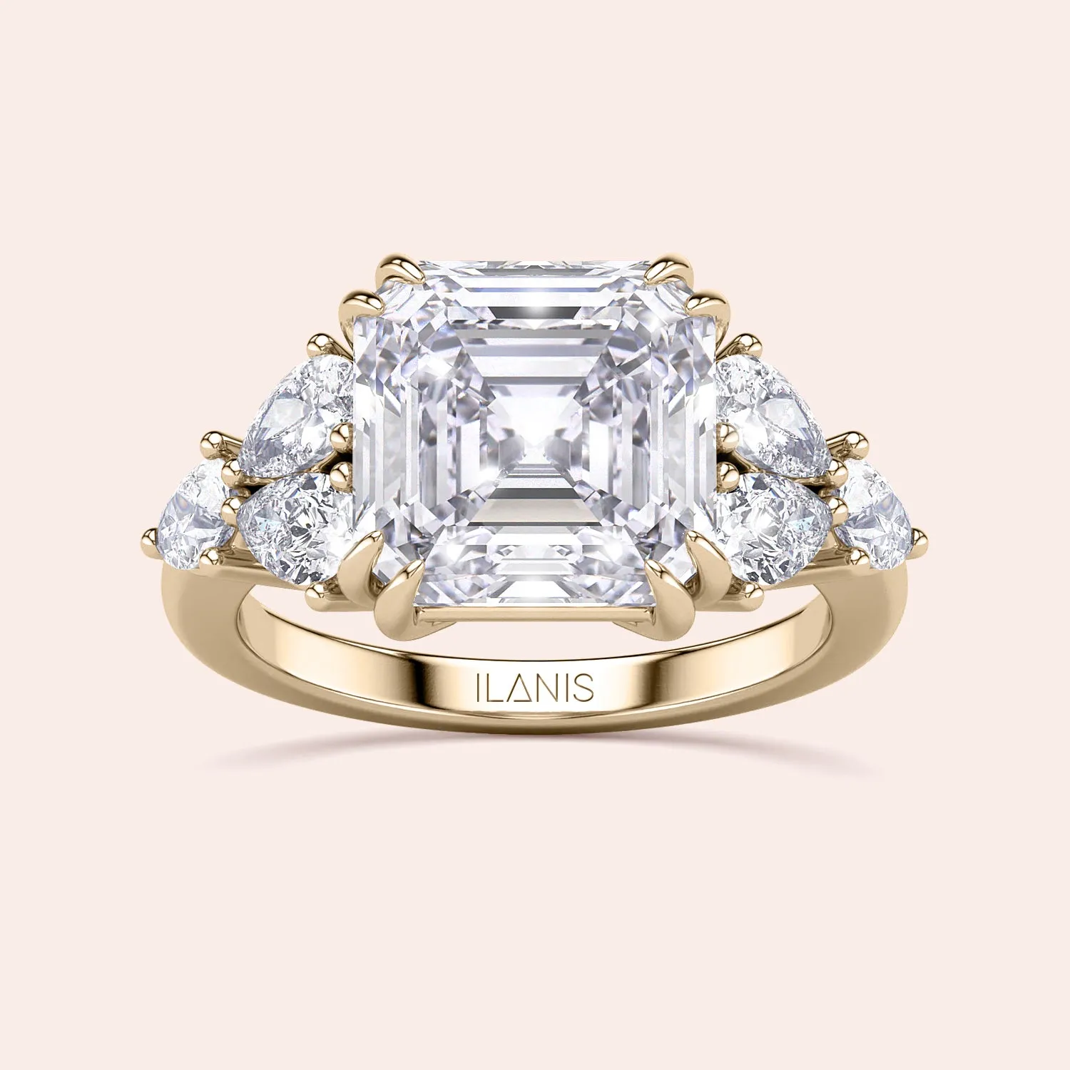 STARLET ASSCHER CUT DIAMOND RING WITH PEAR-SHAPED SIDE STONES