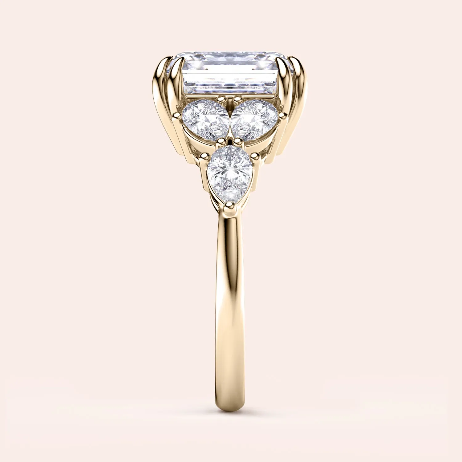 STARLET ASSCHER CUT DIAMOND RING WITH PEAR-SHAPED SIDE STONES