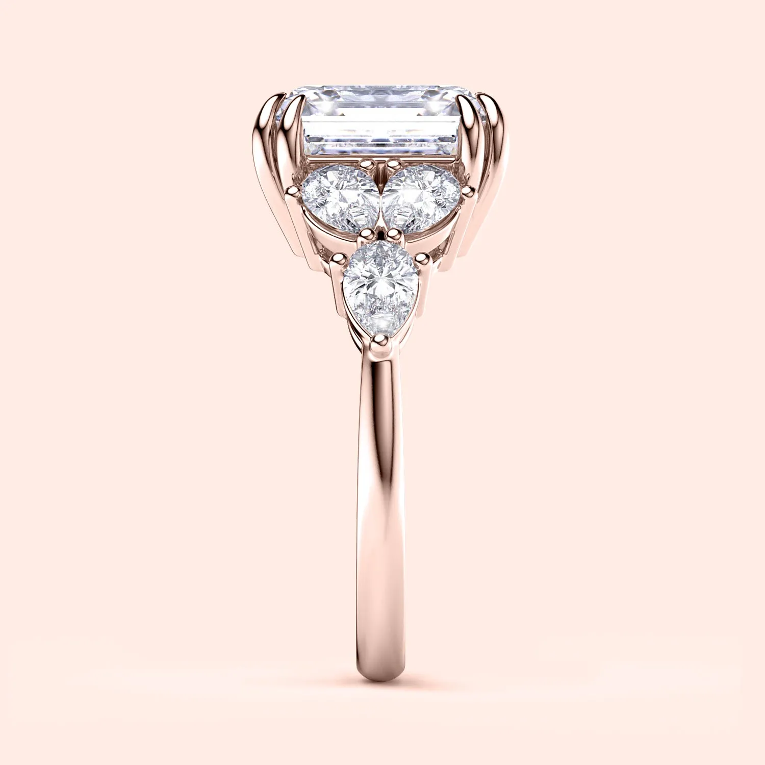 STARLET ASSCHER CUT DIAMOND RING WITH PEAR-SHAPED SIDE STONES