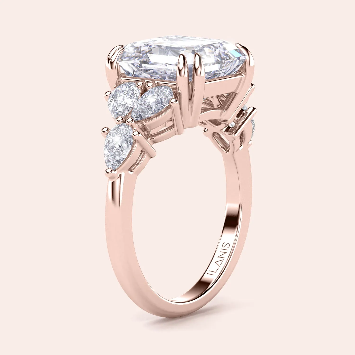 STARLET ASSCHER CUT DIAMOND RING WITH PEAR-SHAPED SIDE STONES