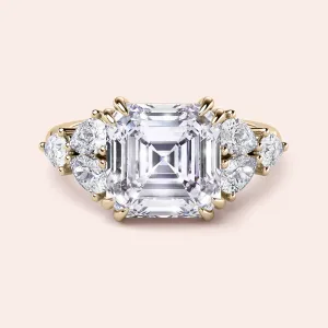 STARLET ASSCHER CUT DIAMOND RING WITH PEAR-SHAPED SIDE STONES