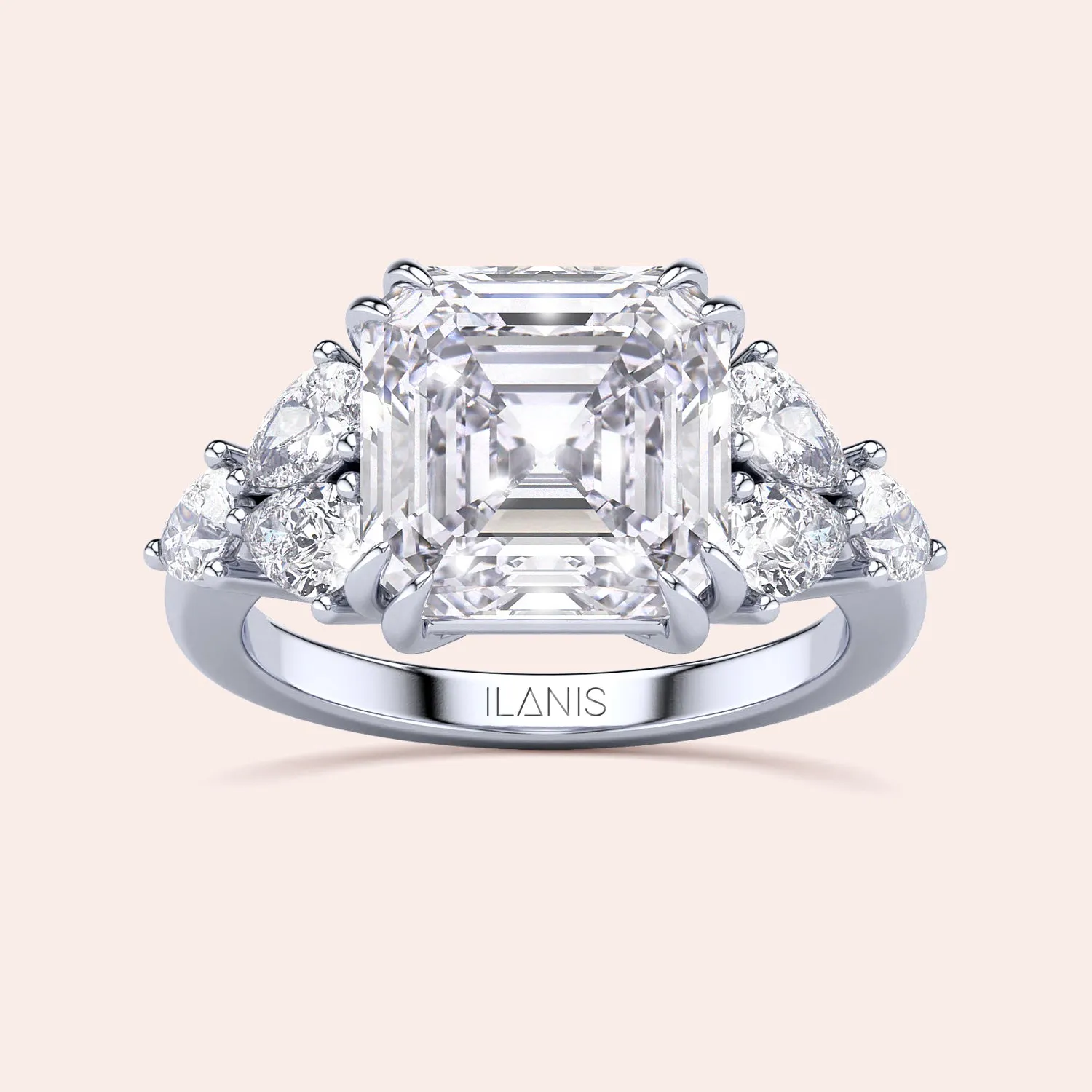 STARLET ASSCHER CUT DIAMOND RING WITH PEAR-SHAPED SIDE STONES