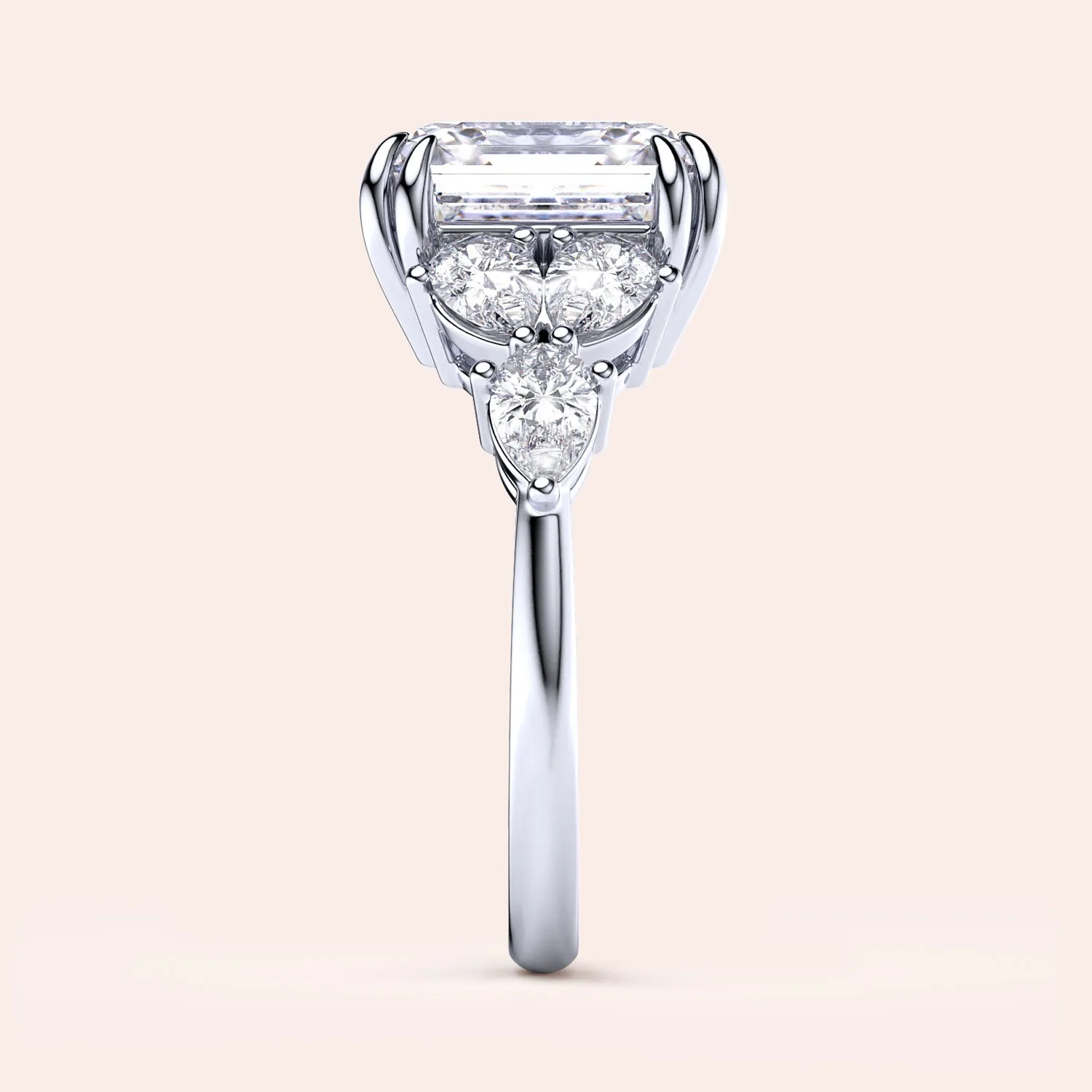 STARLET ASSCHER CUT DIAMOND RING WITH PEAR-SHAPED SIDE STONES