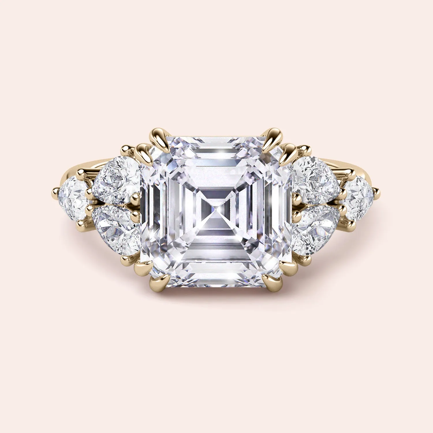 STARLET ASSCHER CUT DIAMOND RING WITH PEAR-SHAPED SIDE STONES