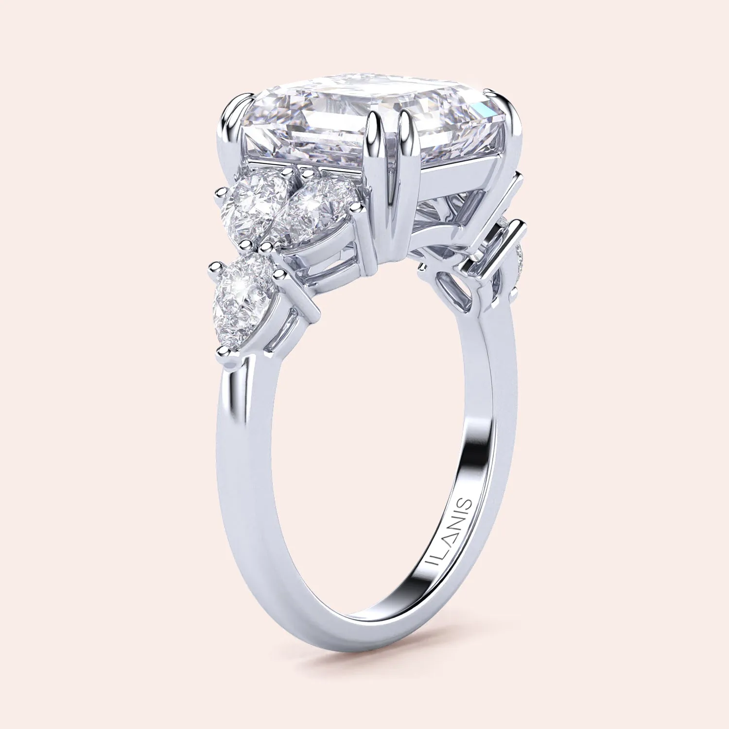 STARLET ASSCHER CUT DIAMOND RING WITH PEAR-SHAPED SIDE STONES