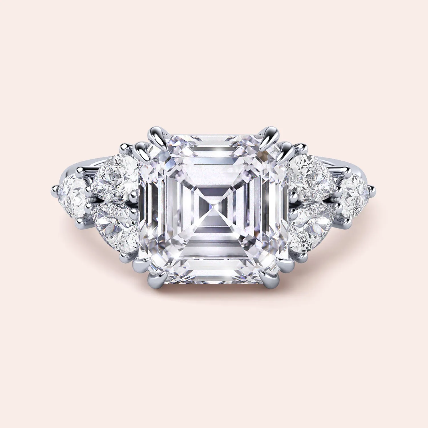 STARLET ASSCHER CUT DIAMOND RING WITH PEAR-SHAPED SIDE STONES