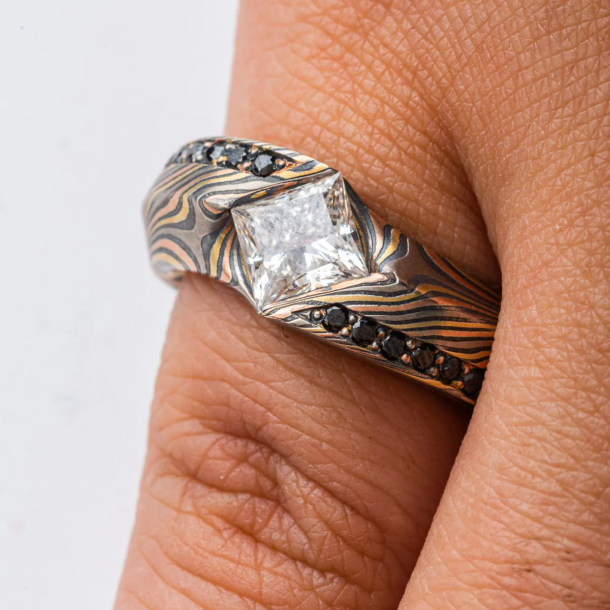 Unique Mokume Gane Ring in Twist Pattern and Firestorm Palette with Cathedral Set Square Diamond and Bead Set Black Diamonds